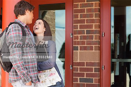 High school students outside school building