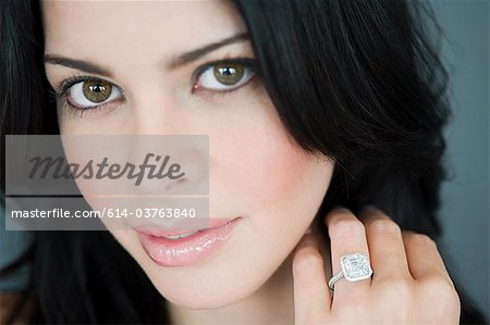 Young woman wearing engagement ring