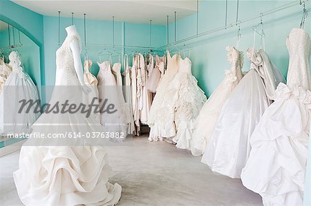 Selection of wedding dresses in boutique