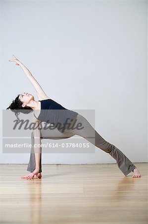Woman in warrior position during yoga