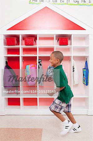 Boy running in school