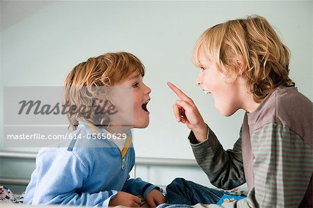 Two young boys quarrelling Two young boys quarrelling