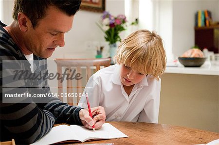 Father helping son with his homework