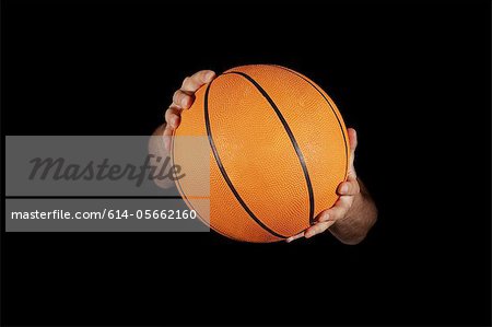 Close up of basket ball being held