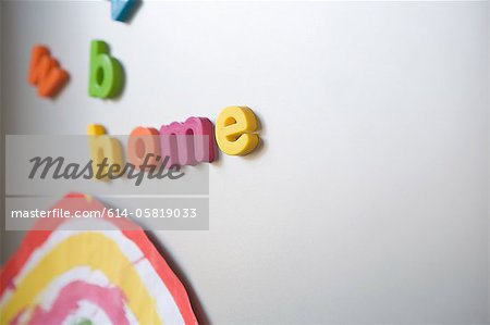 Letters spelling "home" on family refrigerator