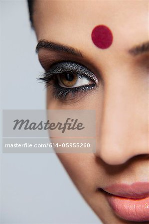 https://image1.masterfile.com/getImage/614-05955260em-closeup-of-a-beautiful-woman-with-a-bindi-stock-photo.jpg