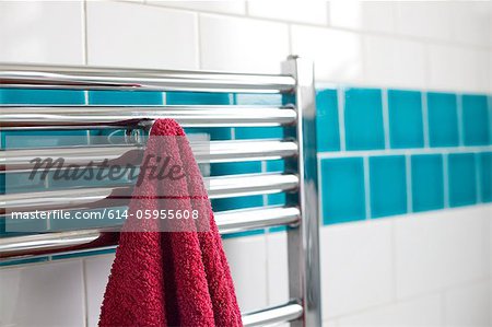 Towel hanging on a rail in bathroom