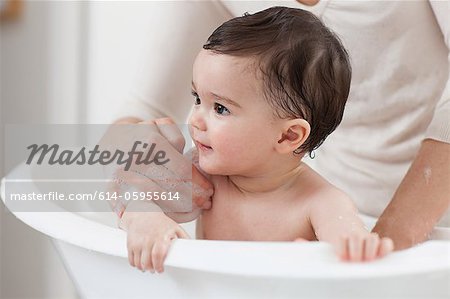 Baby boy having a bath