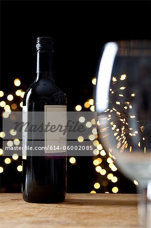 Bottle of red wine and empty glass Bottle of red wine and empty glass