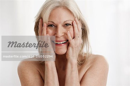 Mature woman laughing, portrait