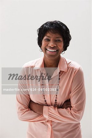 Portrait of smiling African American mature woman, studio shot