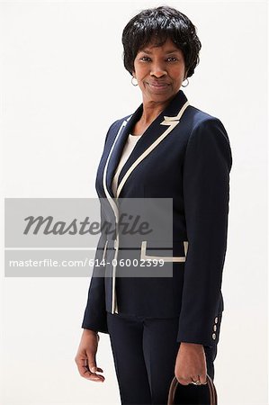 Portrait of smiling African American mature woman, studio shot