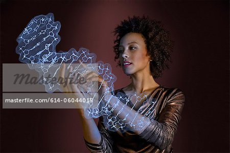 Woman interacting with holographic genome Woman interacting with holographic genome