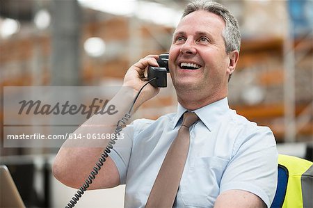 Warehouse manager on the phone
