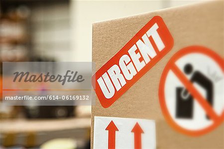 Cardboard box with warning stickers, close up