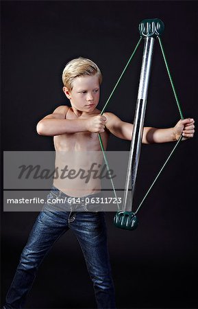Boy using chest expander