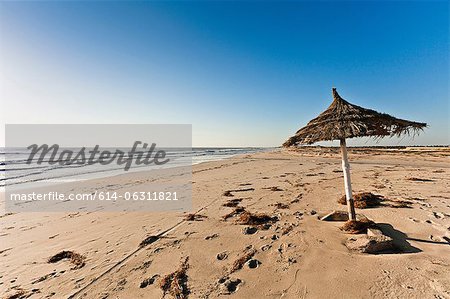 Parasol on beach on island of Djerba, Tunisia