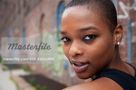 Portrait of a young woman with shaved head