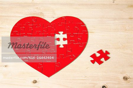 Heart shaped jigsaw puzzle with missing piece