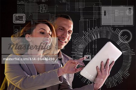 Business people with digital tablet and technological diagram Business people with digital tablet and technological diagram
