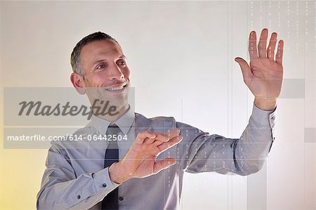 Businessman using virtual data Businessman using virtual data