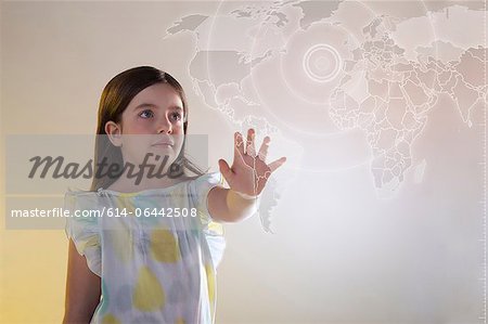 Girl touching virtual world map Girl touching virtual world map