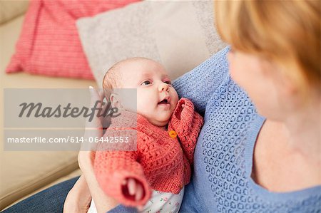 Mother holding newborn daughter