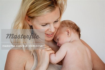 Mother holding newborn baby boy