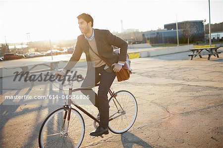 Man riding bicycle on city street