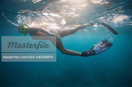 Woman snorkeling in tropical water