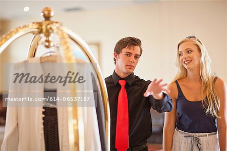 Porter talking to woman in hotel lobby