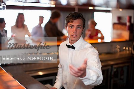 Waiter taking order at restaurant bar