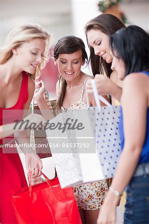 Women looking in shopping bags