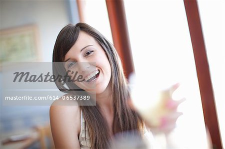 Woman having wine in restaurant