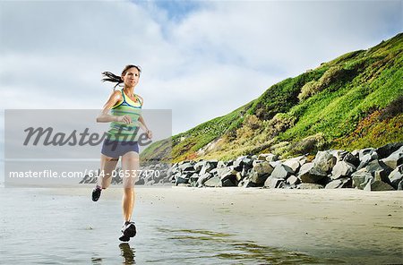 Woman running on beach