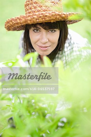 Smiling woman working in garden