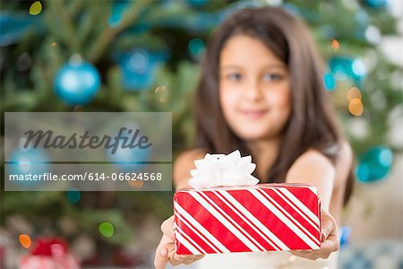 Girl holding Christmas present