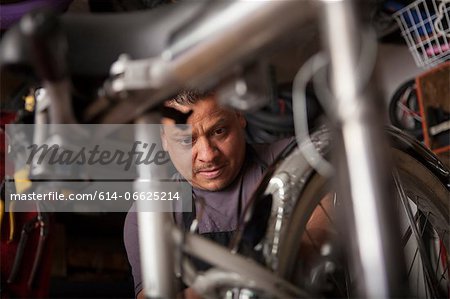 Mechanic working in bicycle shop Mechanic working in bicycle shop