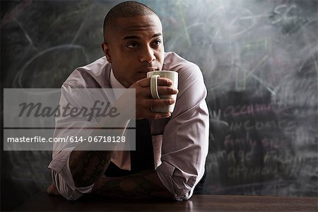 Man drinking cup of coffee