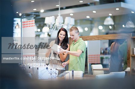 Couple shopping for kitchenware in store
