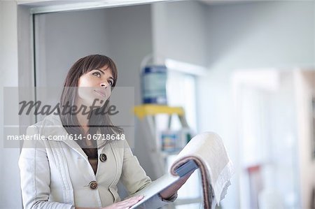 Businesswoman looking at fabric swatches