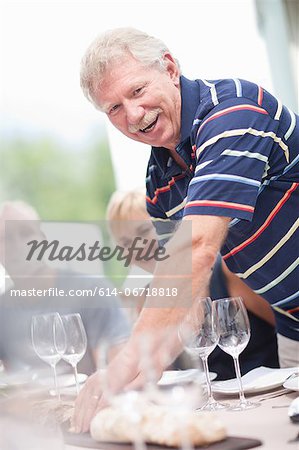 Man setting table outdoors