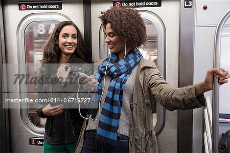 Women talking on subway