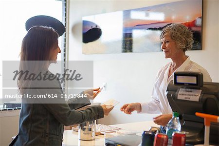 Cashier talking to customer in store