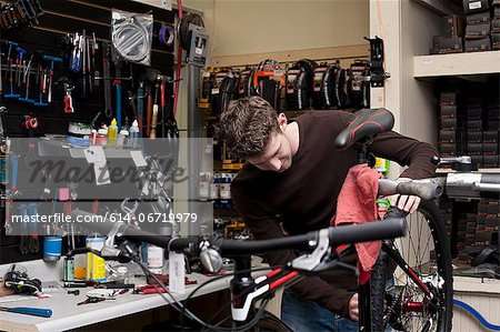 Mechanic working in bicycle repair shop