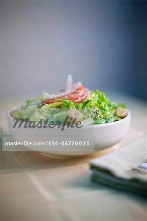 Bowl of salad on table