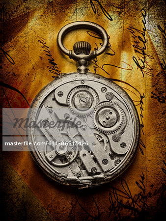 Pocket watch with open back on handwritten letter