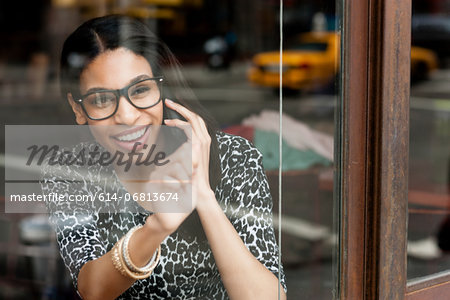 Woman knocking on glass window to get someone's attention