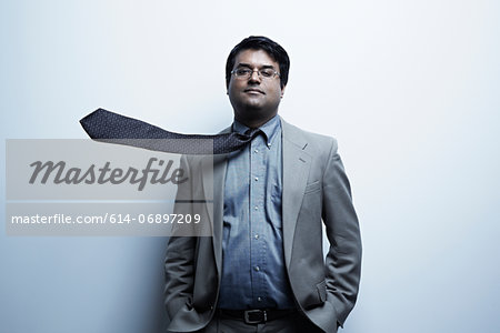Studio portrait of businessman with flyaway tie
