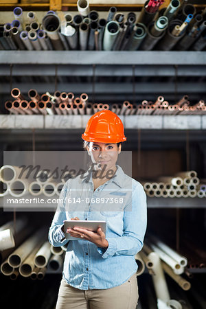 Woman in warehouse with digital tablet Woman in warehouse with digital tablet